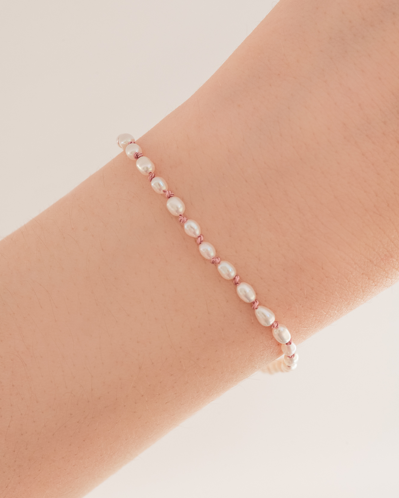 Dream Pearl Bracelet Knotted on pink thread